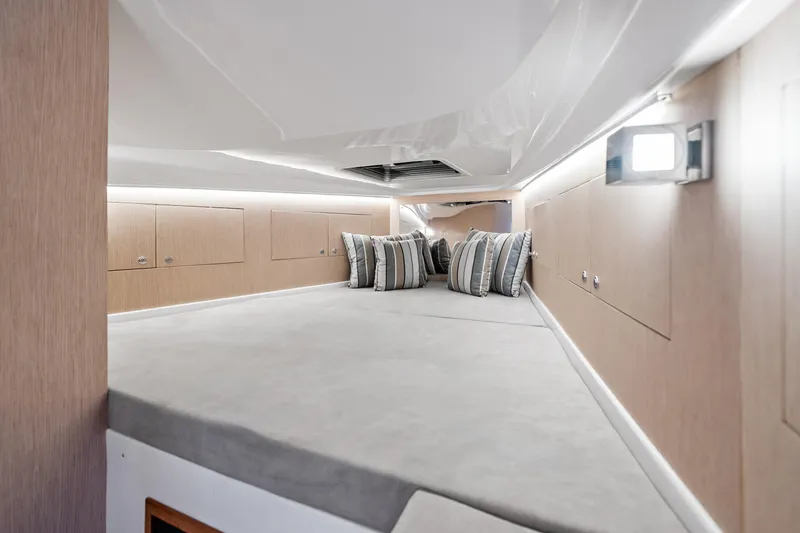 Slide: The Image of Luxurious interior cabin of 2021 Magazzu TARGA 45 with modern design and striped pillows. - 11