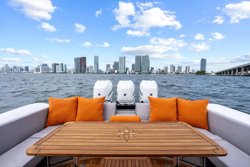 Slide: The Image of Luxury Magazzu TARGA 45 boat with orange cushions, city skyline view, 2021 model. - 19