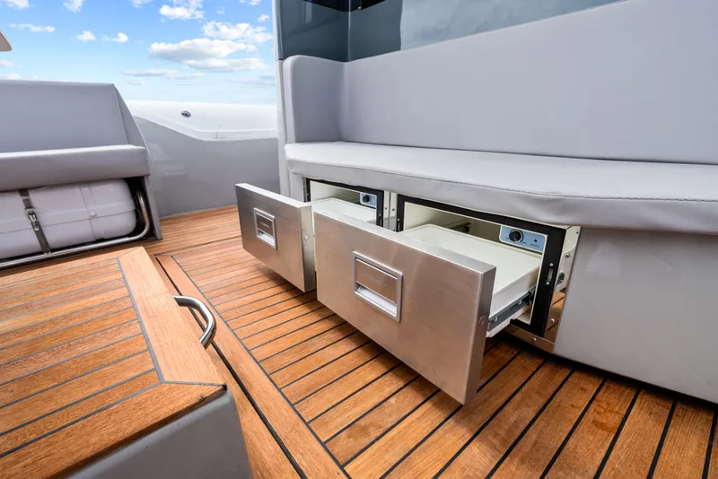 Slide: The Image of 2021 Magazzu TARGA 45 yacht interior with open storage drawers on teak deck. - 21
