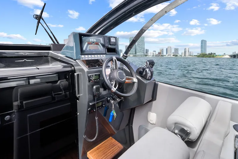 Slide: The Image of Interior view of 2021 Magazzu TARGA 45 yacht cockpit with city skyline in background. - 25