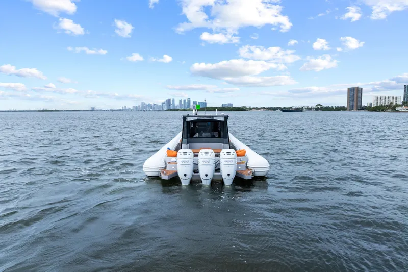Slide: The Image of 2021 Magazzu TARGA 45 boat on water with city skyline in background. - 7