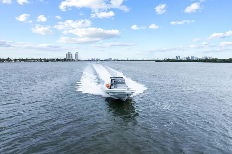 Slide: The Image of 2021 Magazzu TARGA 45 boat cruising on open water under a blue sky. - 9