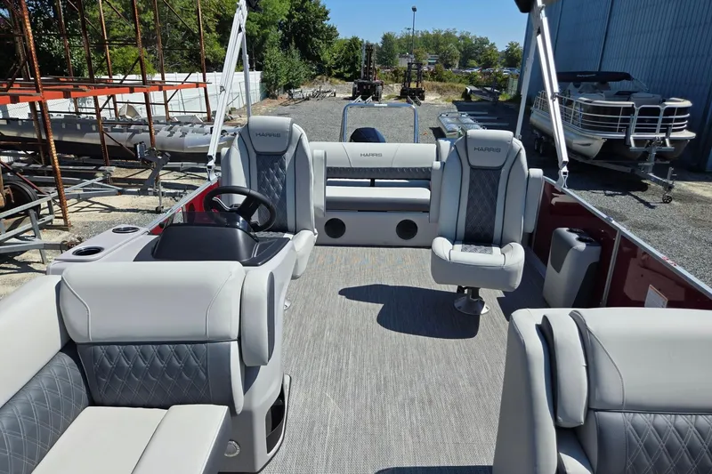 Slide: The Image of 2026 Harris Cruiser 230 pontoon boat interior with luxurious seating and modern design. - 10