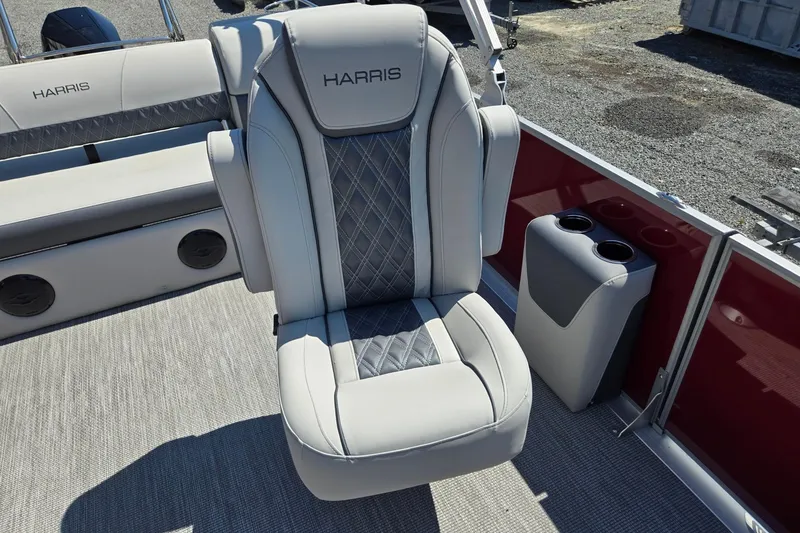 Slide: The Image of 2026 Harris Cruiser 230 boat seat with cup holders, featuring elegant gray upholstery. - 13