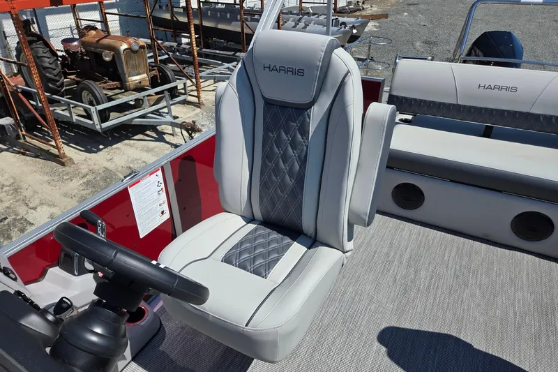 Slide: The Image of 2026 Harris Cruiser 230 boat interior with luxurious seating and steering wheel. - 14