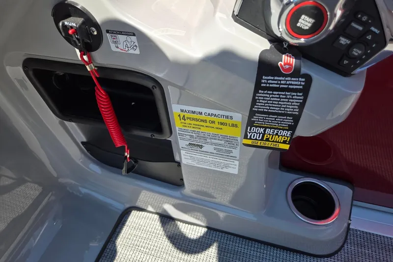 Slide: The Image of Control panel of 2026 Harris Cruiser 230 boat with safety and capacity labels. - 19
