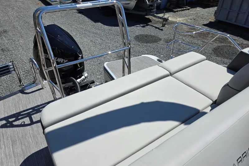 Slide: The Image of 2026 Harris Cruiser 230 boat with Mercury engine, featuring comfortable seating and sleek design. - 24