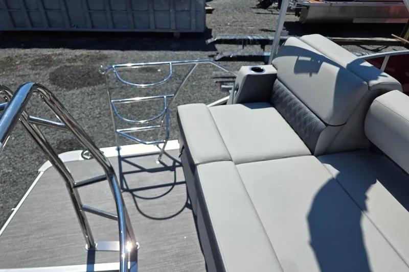Slide: The Image of 2026 Harris Cruiser 230 boat interior with plush seating and stainless steel railings. - 26