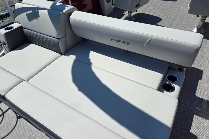 Slide: The Image of Luxurious seating on 2026 Harris Cruiser 230 pontoon boat with cup holders. - 27