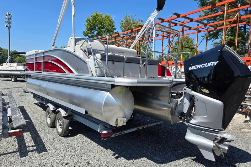 Slide: The Image of 2026 Harris Cruiser 230 pontoon boat with Mercury engine on trailer. - 3