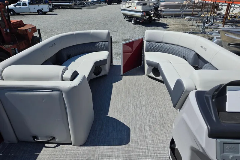 Slide: The Image of 2026 Harris Cruiser 230 pontoon boat interior with plush seating and modern design. - 31