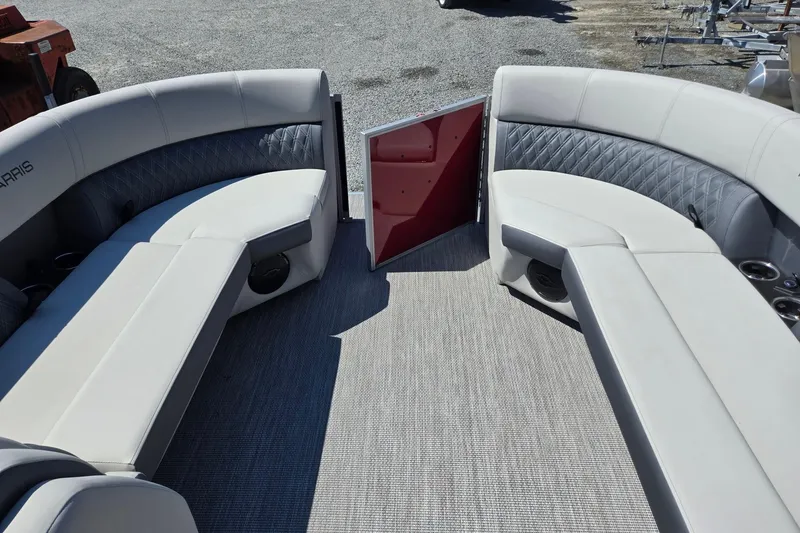 Slide: The Image of 2026 Harris Cruiser 230 interior with plush seating and open gate. - 34