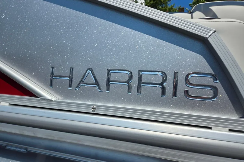 Slide: The Image of 2026 Harris Cruiser 230 boat with metallic finish and embossed logo. - 37