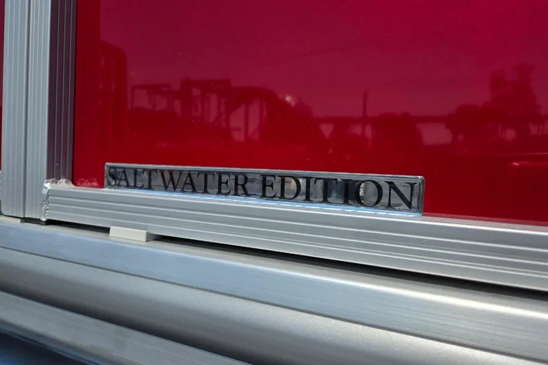 Slide: The Image of 2026 Harris Cruiser 230 Salt Water Edition badge on red background. - 38