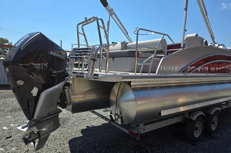 Slide: The Image of 2026 Harris Cruiser 230 pontoon boat with Mercury outboard engine on trailer. - 5