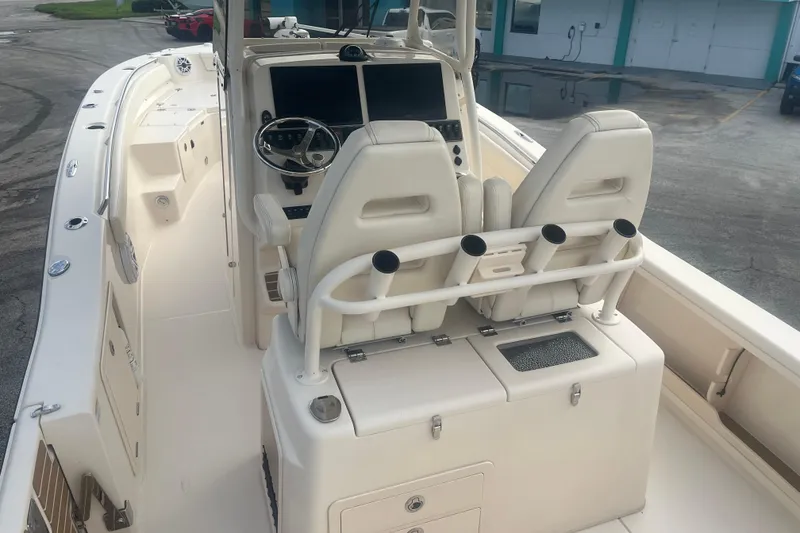 Slide: The Image of 2023 Grady-White 281 Coastal Explorer boat interior with dual seats and control panel. - 10