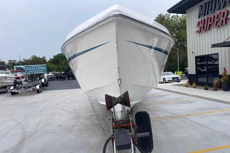 Slide: The Image of 1998 Nor-Tech 5000V Diesel boat on trailer at dealership parking lot. - 10