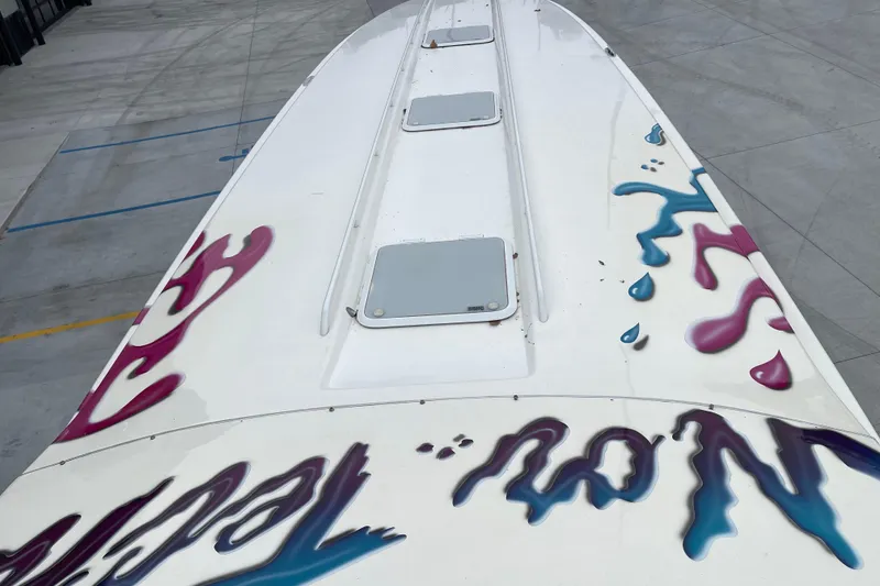 Slide: The Image of Top view of 1998 Nor-Tech 5000V Diesel boat with colorful graphics. - 20