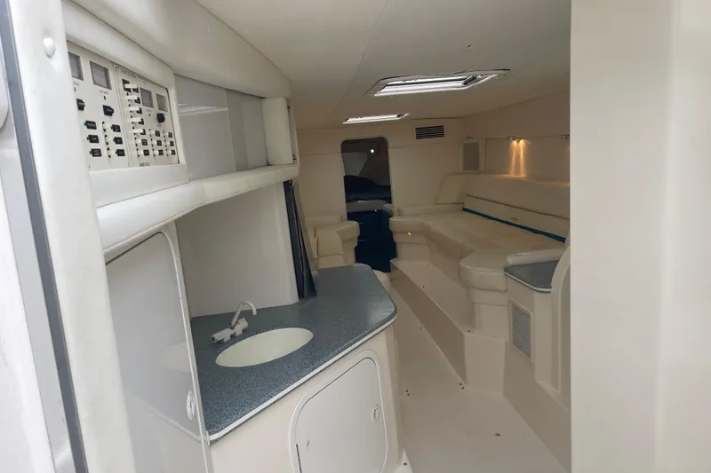 Slide: The Image of Interior of 1998 Nor-Tech 5000V Diesel boat with seating and control panel. - 25