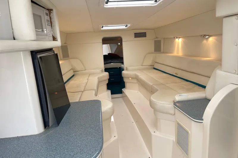 Slide: The Image of Luxurious interior of a 1998 Nor-Tech 5000V Diesel boat with plush seating and modern amenities. - 26