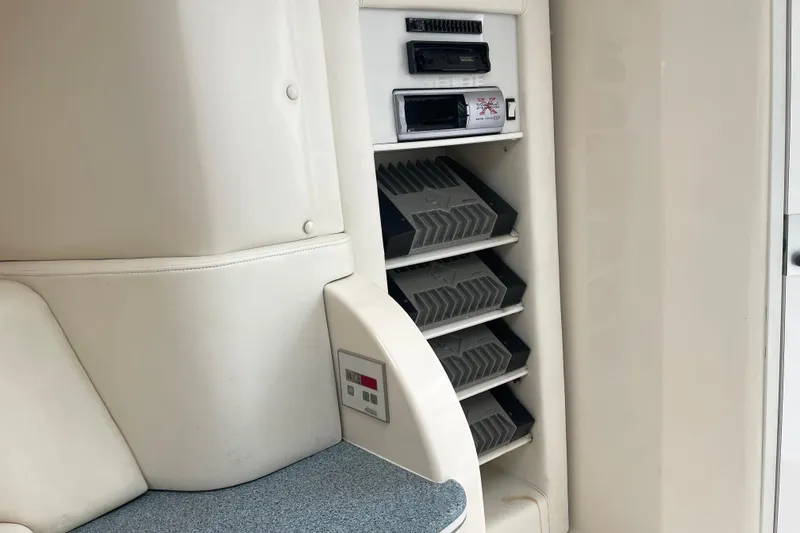 Slide: The Image of Interior of 1998 Nor-Tech 5000V Diesel boat with audio equipment and seating. - 28