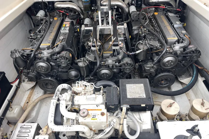 Slide: The Image of Engine compartment of a 1998 Nor-Tech 5000V Diesel boat, showcasing dual engines. - 36
