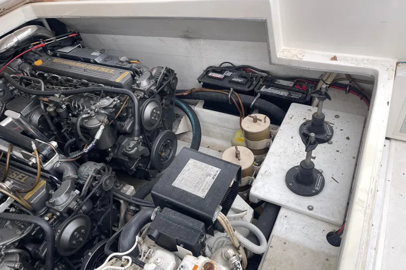 Slide: The Image of Engine compartment of a 1998 Nor-Tech 5000V Diesel boat, showcasing mechanical components. - 37