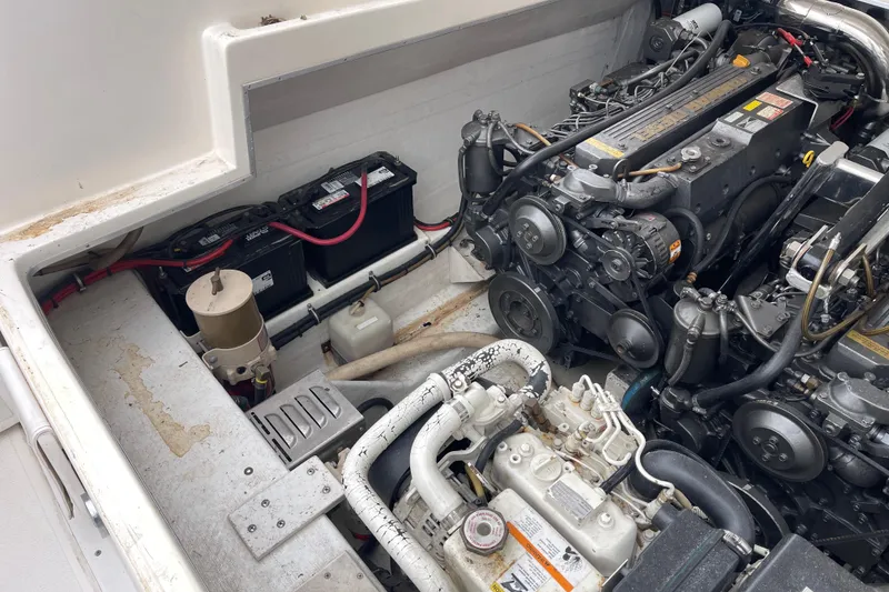 Slide: The Image of Engine compartment of a 1998 Nor-Tech 5000V Diesel boat, showcasing dual engines and battery setup. - 38