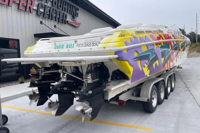 Slide: The Image of 1998 Nor-Tech 5000V Diesel boat with vibrant graffiti design on a trailer. - 4