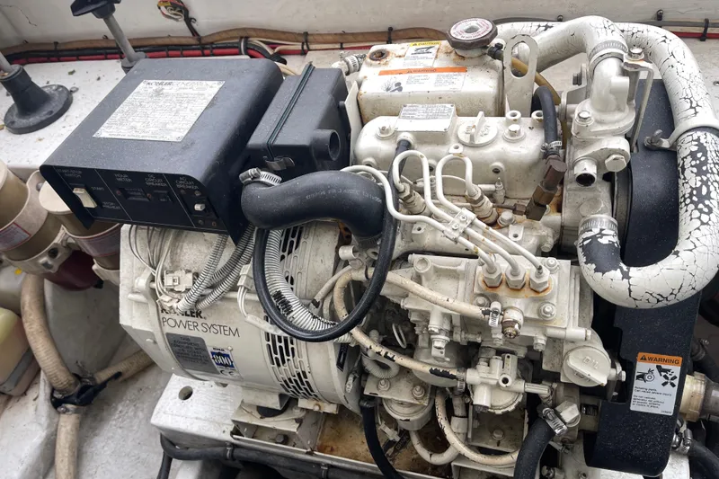 Slide: The Image of 1998 Nor-Tech 5000V Diesel engine with visible components and wiring in a boat. - 42