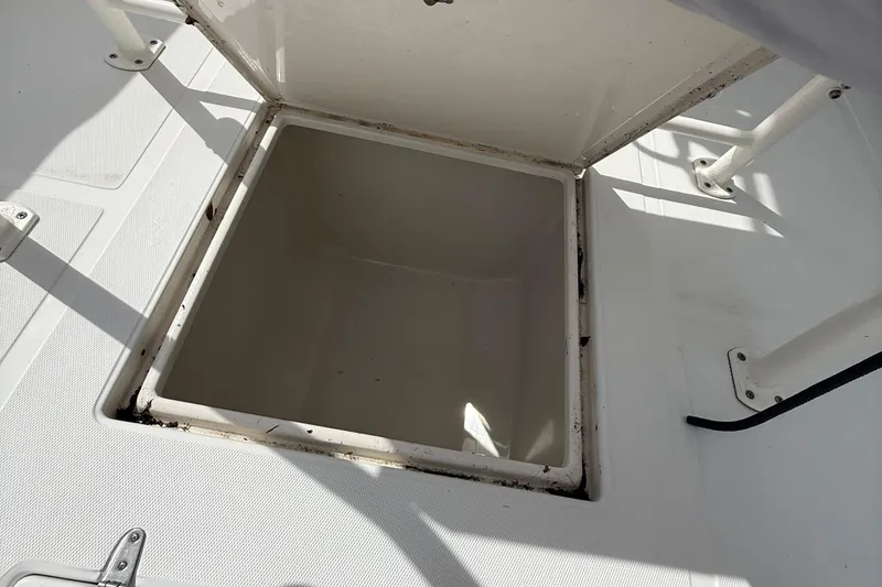 Slide: The Image of Open storage compartment on a 2007 Jupiter 31 boat deck. - 13