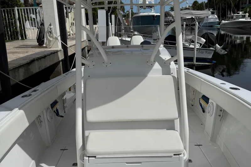 Slide: The Image of 2007 Jupiter 31 boat interior with white seating, docked at marina. - 21