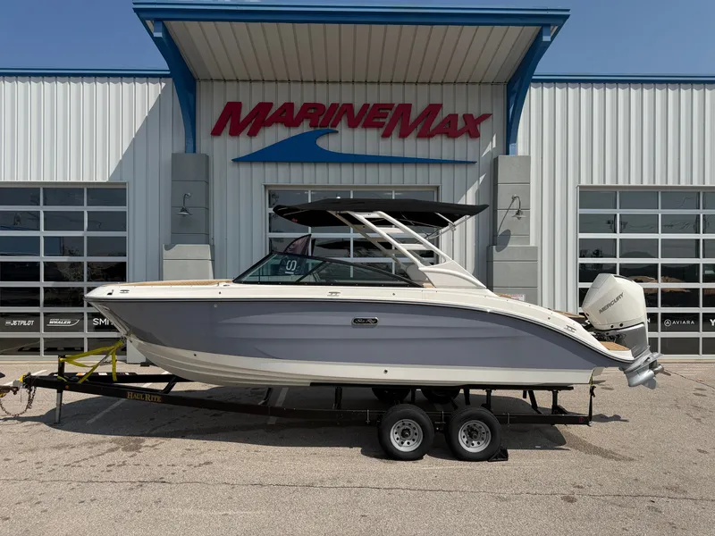 Slide: The Image of A 2026 Sea Ray SDX 250 Outboard on a trailer in front of a MarineMax building. - 0