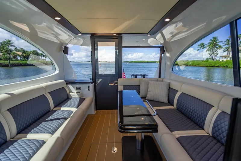 Slide: The Image of Luxurious interior of 2019 Palm Beach Motor Yachts GT50, featuring elegant seating and scenic water views. - 18