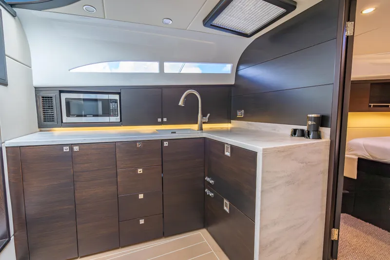 Slide: The Image of Luxurious 2019 Palm Beach Motor Yachts GT50 kitchen with modern cabinetry and appliances. - 34