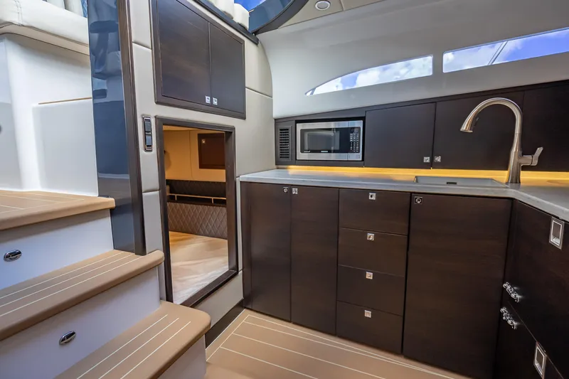 Slide: The Image of 2019 Palm Beach Motor Yachts GT50 interior with modern kitchen and sleek cabinetry. - 35