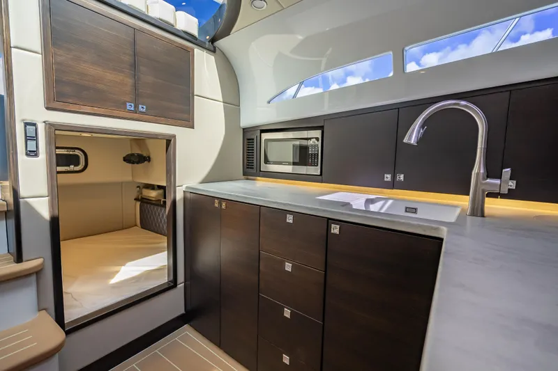 Slide: The Image of Luxurious 2019 Palm Beach Motor Yachts GT50 interior with modern kitchen and sleek cabinetry. - 36