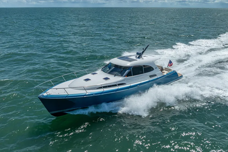 Slide: The Image of 2019 Palm Beach Motor Yachts GT50 cruising on open water. - 5
