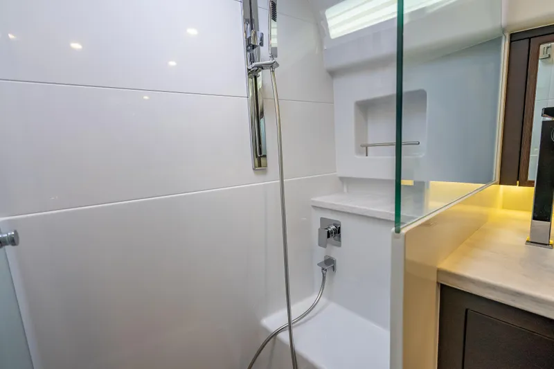 Slide: The Image of Luxurious bathroom in 2019 Palm Beach Motor Yachts GT50, featuring modern shower design. - 51