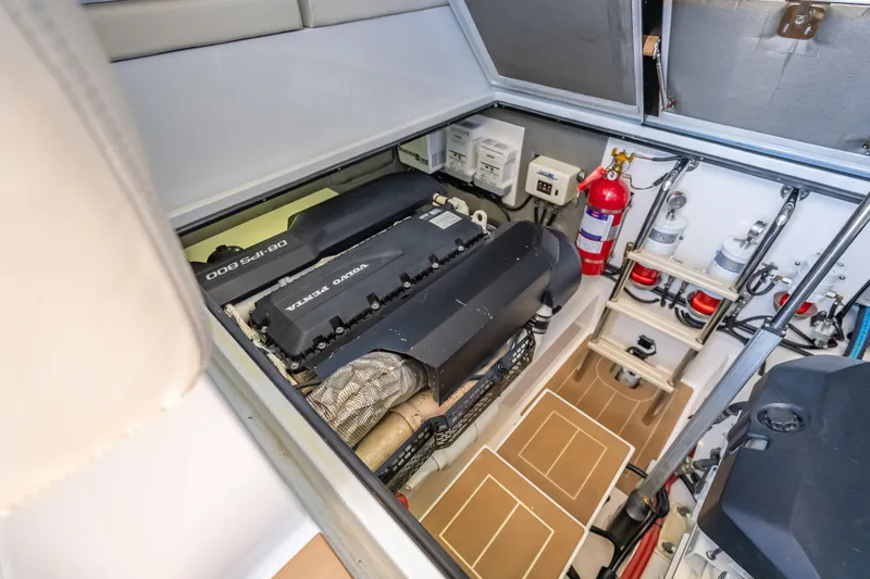 Slide: The Image of Engine room of 2019 Palm Beach Motor Yachts GT50 with Volvo Penta engines and safety equipment. - 58