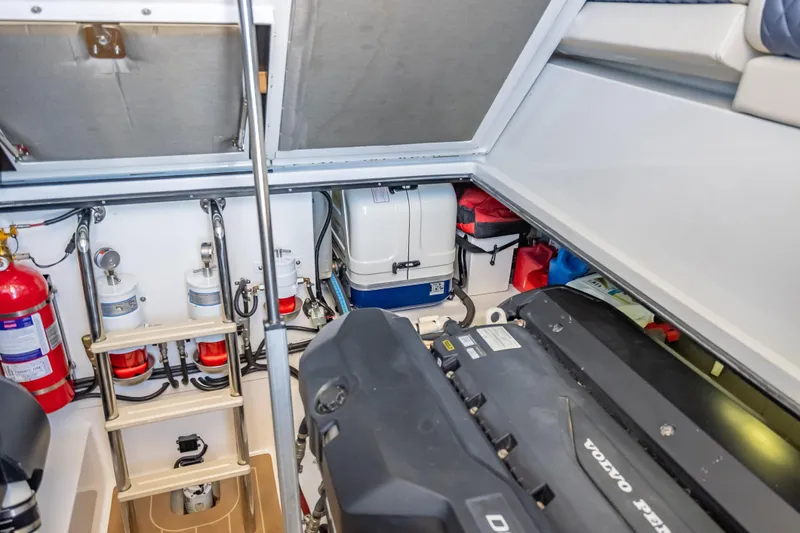 Slide: The Image of Engine room of 2019 Palm Beach Motor Yachts GT50, featuring Volvo Penta engine and safety equipment. - 59