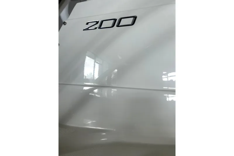 Slide: The Image of Close-up of 2016 Striper 200 Walkaround boat exterior with '200' emblem. - 10
