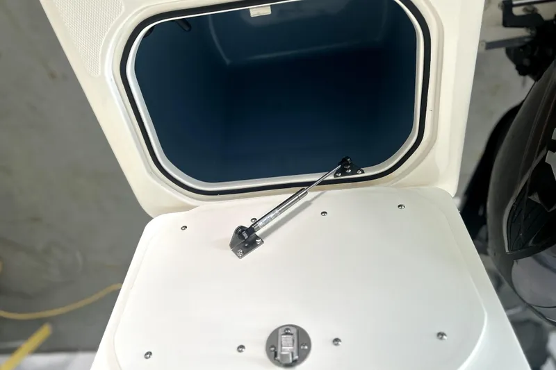 Slide: The Image of Open storage compartment on a 2016 Striper 200 Walkaround boat. - 12