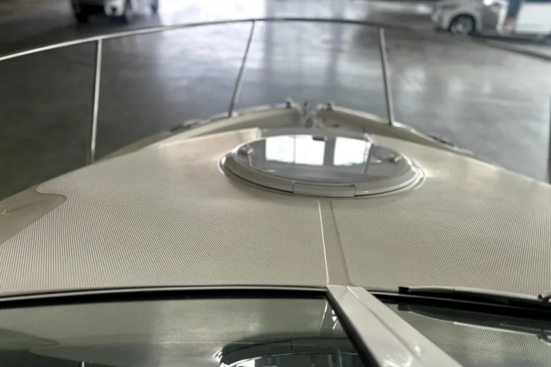 Slide: The Image of 2016 Striper 200 Walkaround boat deck with hatch, in a covered area. - 15