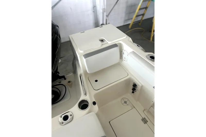 Slide: The Image of 2016 Striper 200 Walkaround boat interior with storage compartments and seating. - 3
