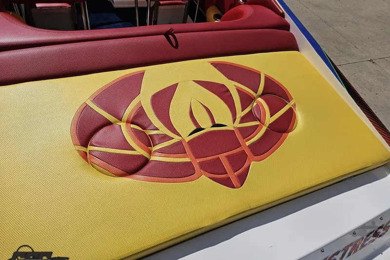 Slide: The Image of 1995 Wellcraft 29 Scarab boat with red and yellow custom upholstery design. - 36