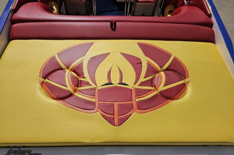 Slide: The Image of 1995 Wellcraft 29 Scarab boat with vibrant red and yellow upholstery design. - 38