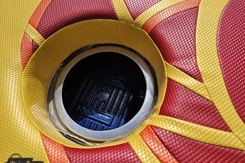 Slide: The Image of Colorful inflatable tube with circular opening, featuring red and yellow patterns. - 41