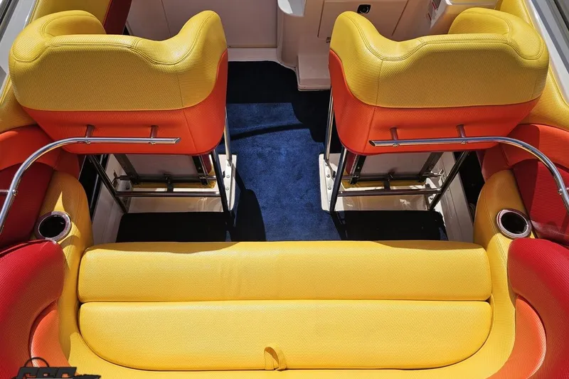 Slide: The Image of 1995 Wellcraft 29 Scarab boat interior with vibrant yellow and orange seating. - 47