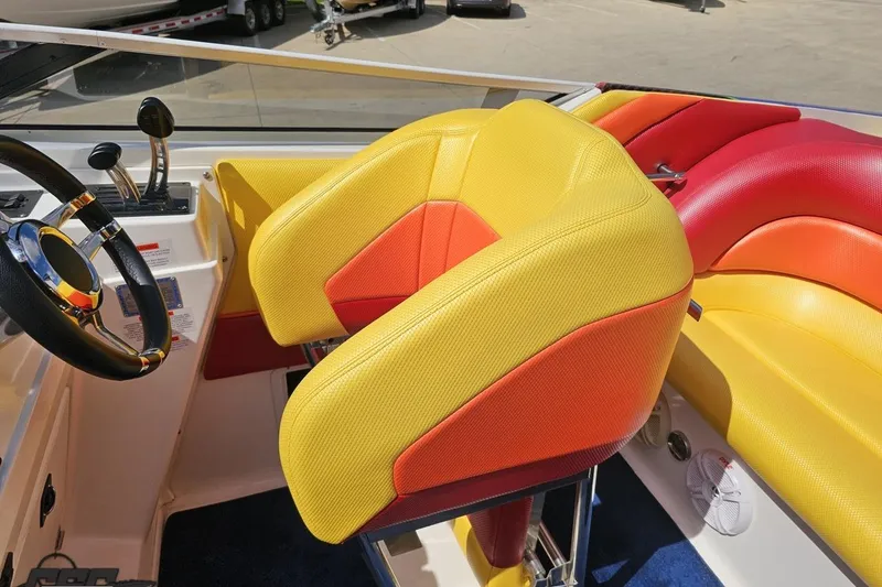 Slide: The Image of Interior of 1995 Wellcraft 29 Scarab boat with vibrant yellow and red seating. - 58